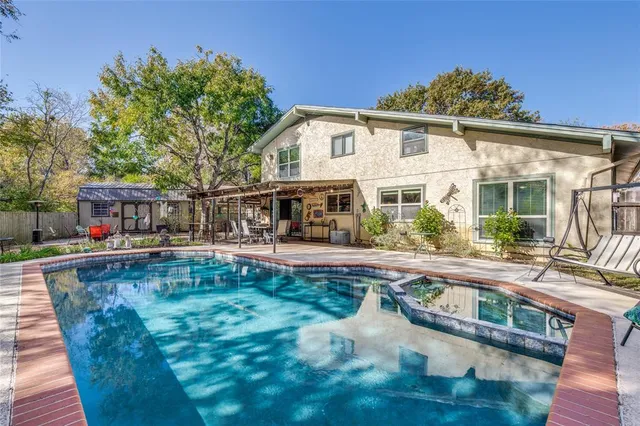 a view of a house with a yard and garage