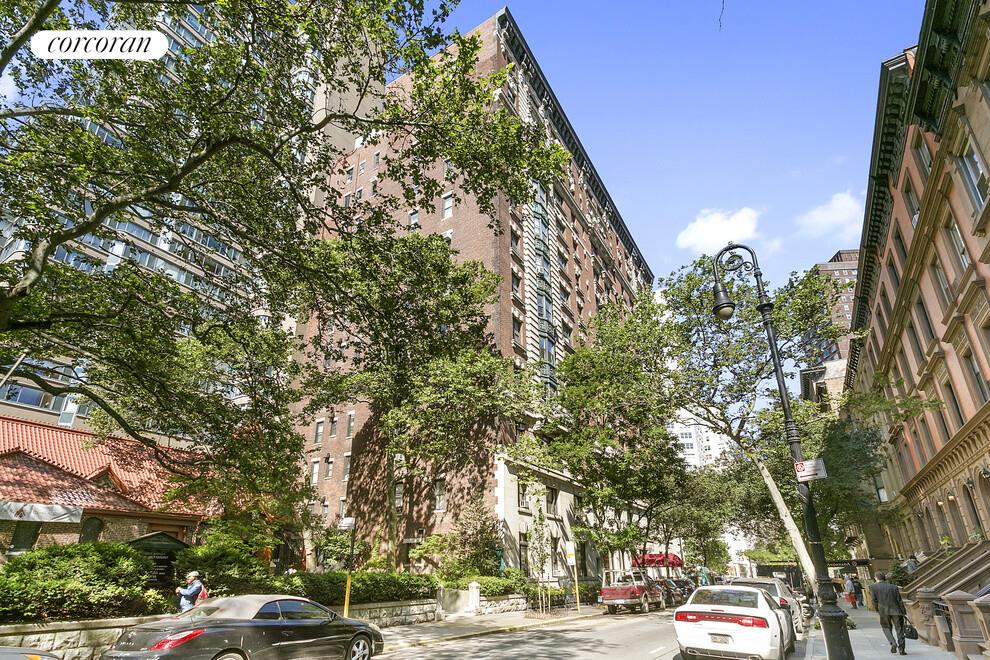 140 West 69th Street, Unit 103B Manhattan, NY 10023 - Photo 11 of 12 a view of street with parked cars