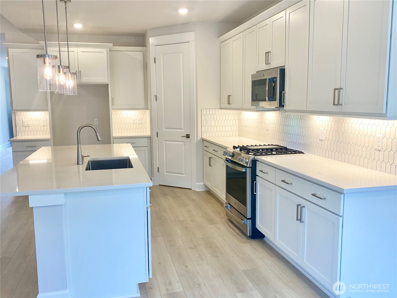 2526 Acer Loop Southeast Lacey, WA 98513 - Photo 3 of 19 a kitchen with stainless steel appliances granite countertop a sink stove and refrigerator