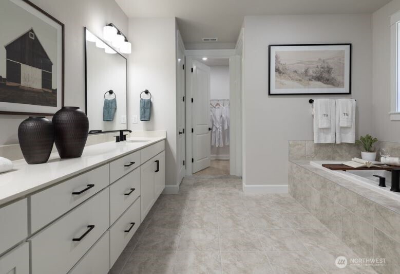 2526 Acer Loop Southeast Lacey, WA 98513 - Photo 8 of 19 a spacious bathroom with a double vanity sink a mirror and a shower