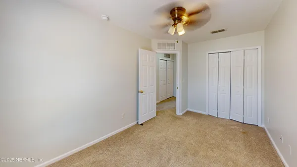 a view of a chandelier fan in a room