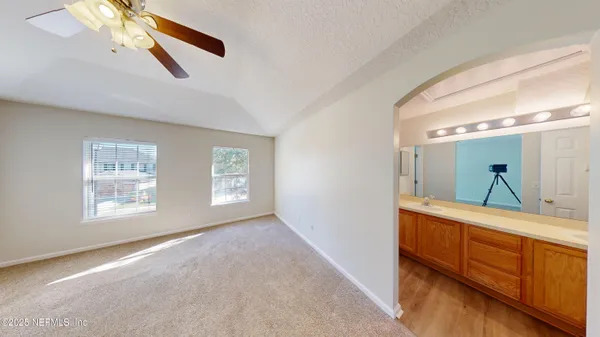 a view of room with window and cabinet