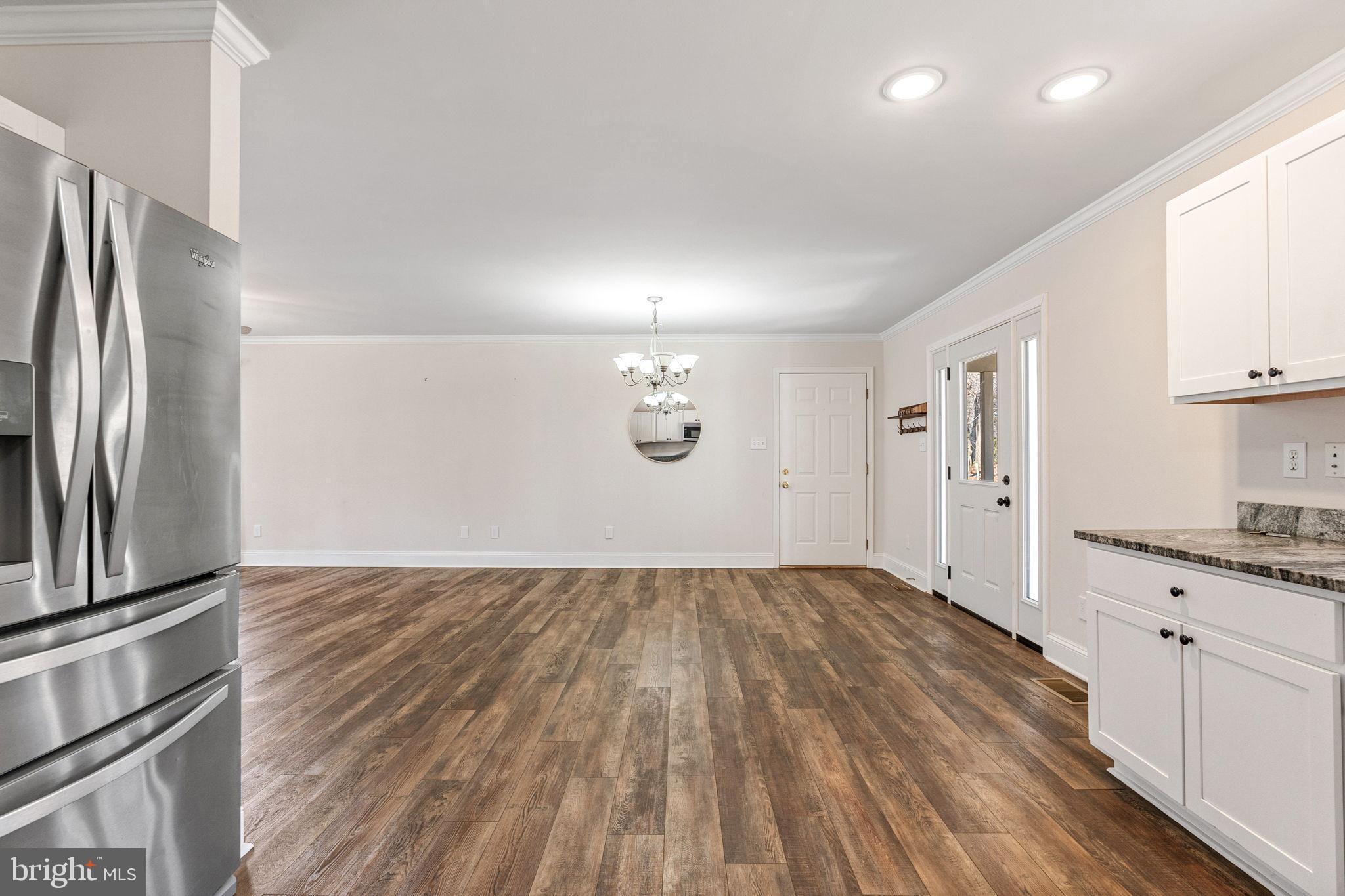 16352 Bullocks Road Ruther Glen, VA 22546 - Photo 12 of 29 a view of a kitchen with wooden floor and electronic appliances