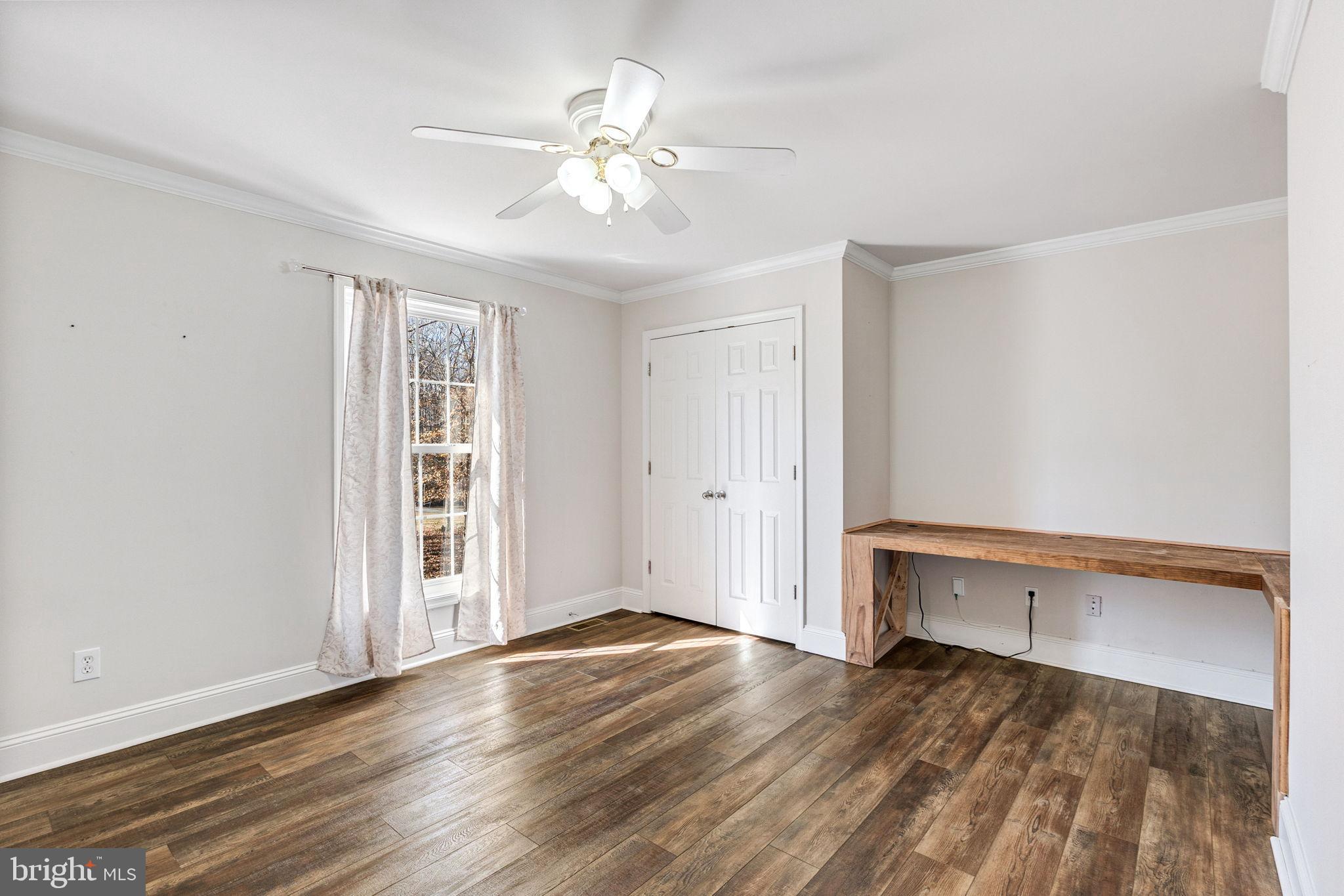 16352 Bullocks Road Ruther Glen, VA 22546 - Photo 20 of 29 wooden floor in an empty room with a window