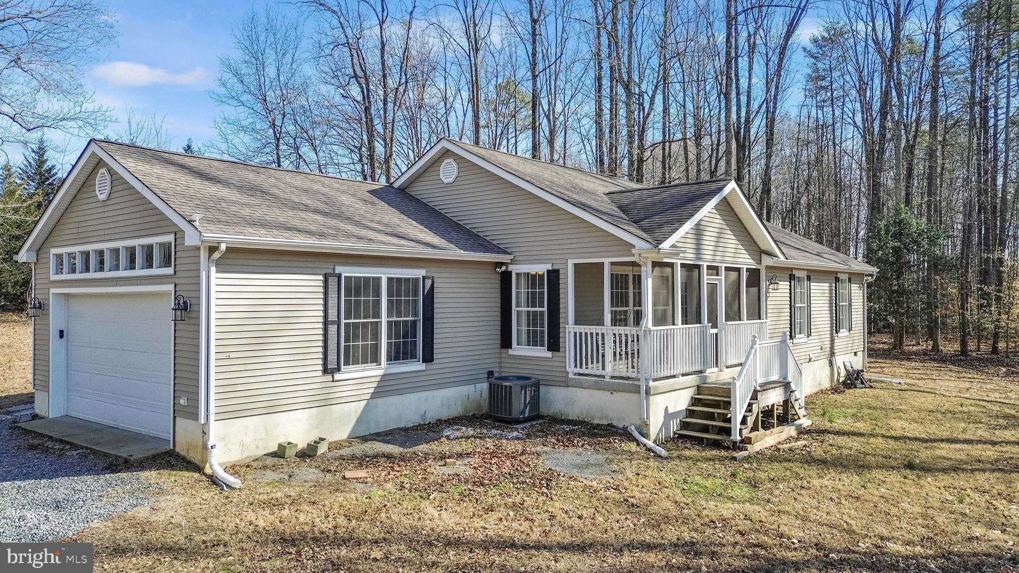 16352 Bullocks Road Ruther Glen, VA 22546 - Photo 26 of 29 a view of a house with a yard