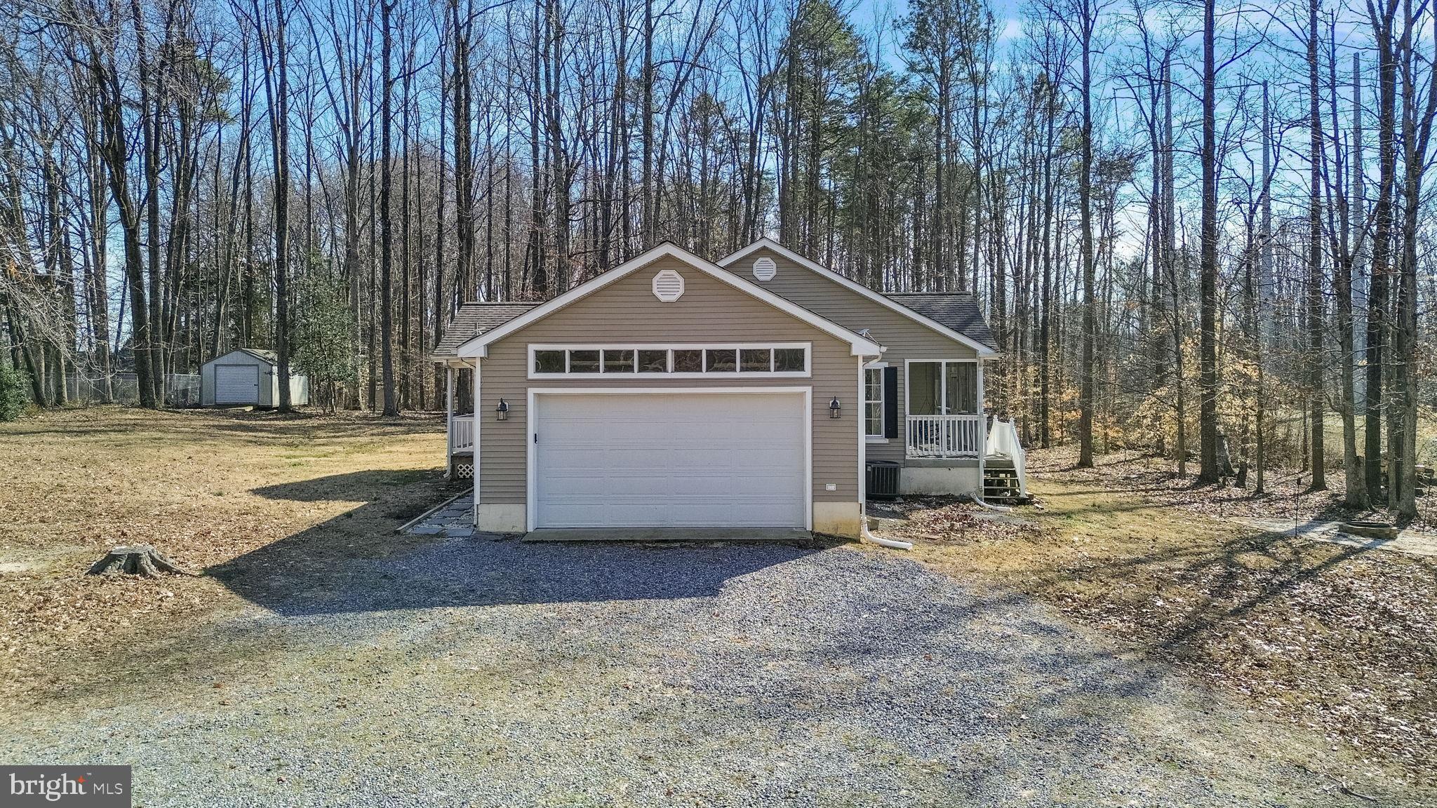16352 Bullocks Road Ruther Glen, VA 22546 - Photo 4 of 29 a front view of a house with a yard