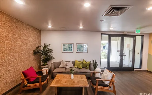 a living room with furniture and a window