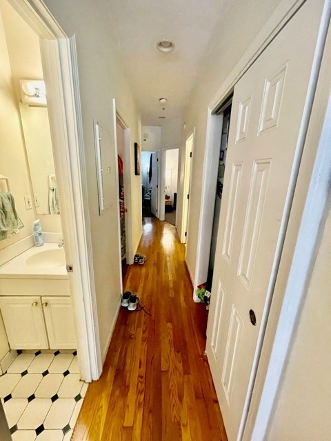 17 Thacher Street, Unit 3 Boston, MA 02113 - Photo 12 of 24 a view of a hallway with wooden floor and staircase