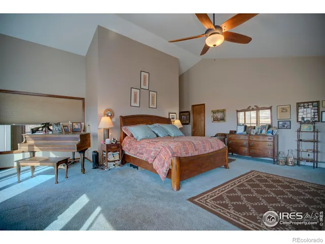 a bedroom with a bed and a table in it