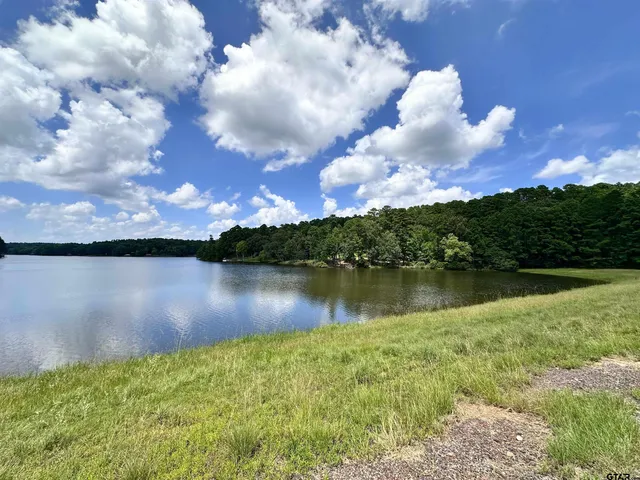 a view of a lake with a big yard