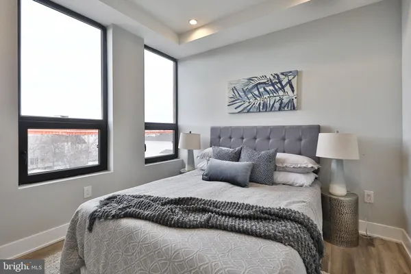 a bedroom with bed and a window