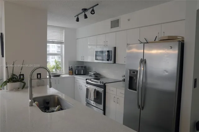 a table and chairs in a room window