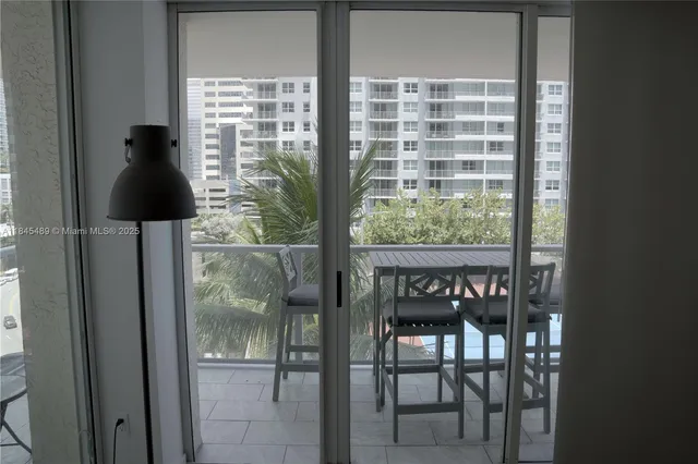 a view of balcony with furniture