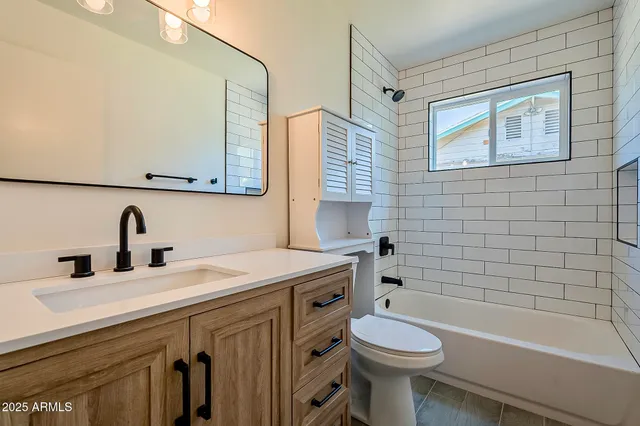 a view of a hallway with a wooden door
