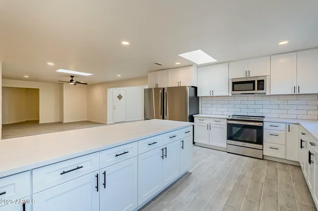 a kitchen with a sink and window
