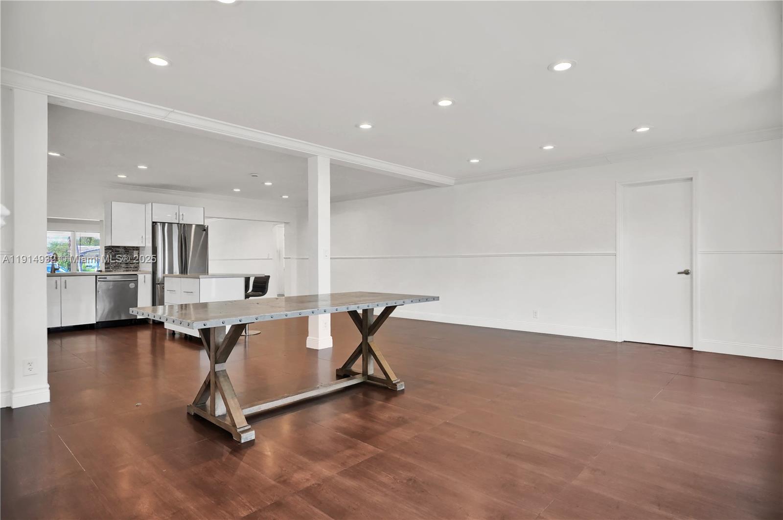 4721 West Park Road Hollywood, FL 33021 - Photo 13 of 34 a view of a kitchen with dining table and chairs