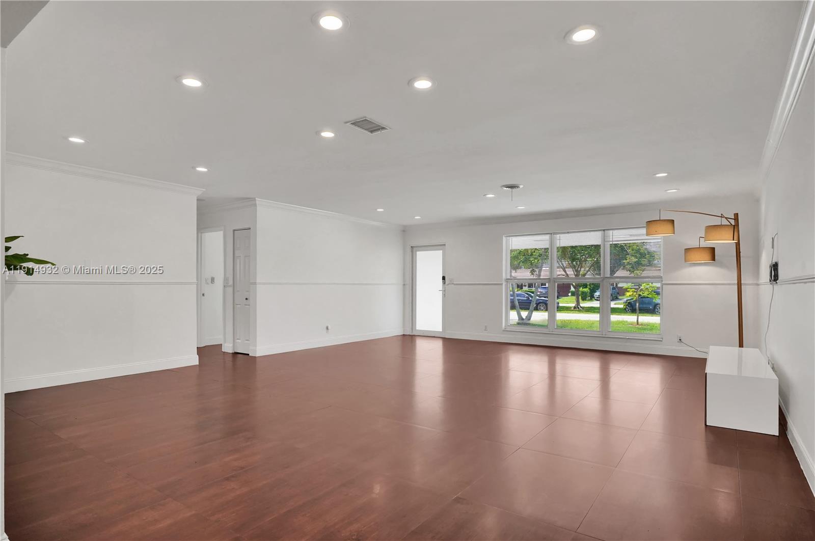 4721 West Park Road Hollywood, FL 33021 - Photo 14 of 34 a view of an empty room with wooden floor and a window