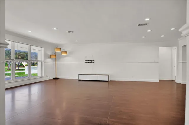 a view of a livingroom with wooden floor