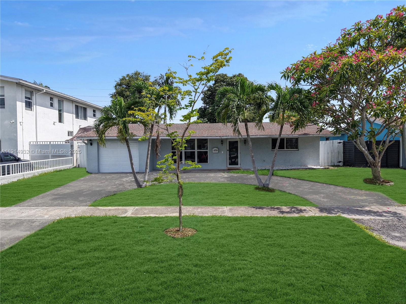 4721 West Park Road Hollywood, FL 33021 - Photo 2 of 34 a front view of a house with garden