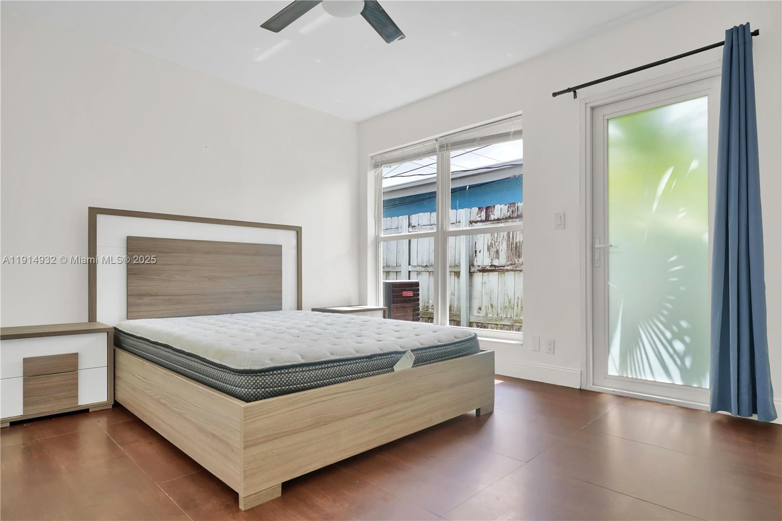 4721 West Park Road Hollywood, FL 33021 - Photo 22 of 34 a bed sitting in a spacious bedroom next to a window