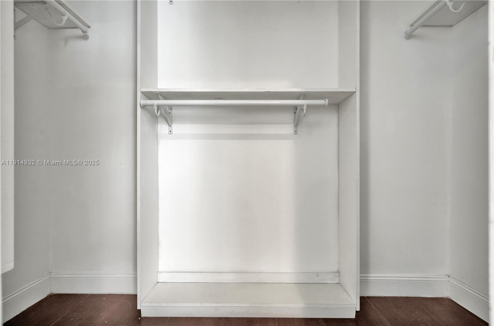 4721 West Park Road Hollywood, FL 33021 - Photo 28 of 34 a view of walk in closet with empty racks