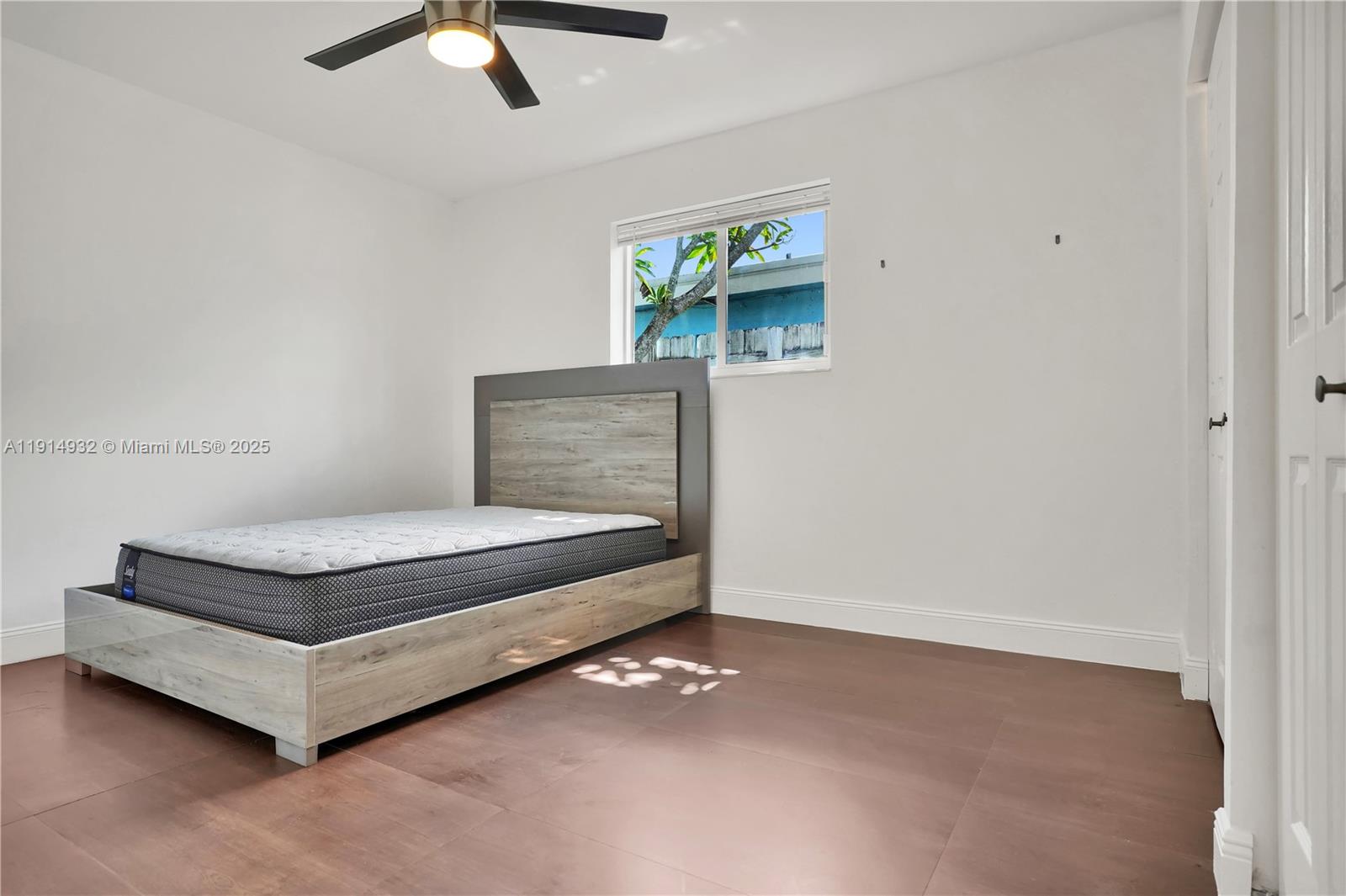 4721 West Park Road Hollywood, FL 33021 - Photo 29 of 34 a living room with furniture and a ceiling fan
