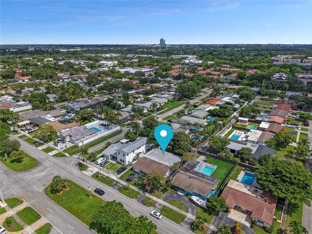 an aerial view of residential houses with outdoor space