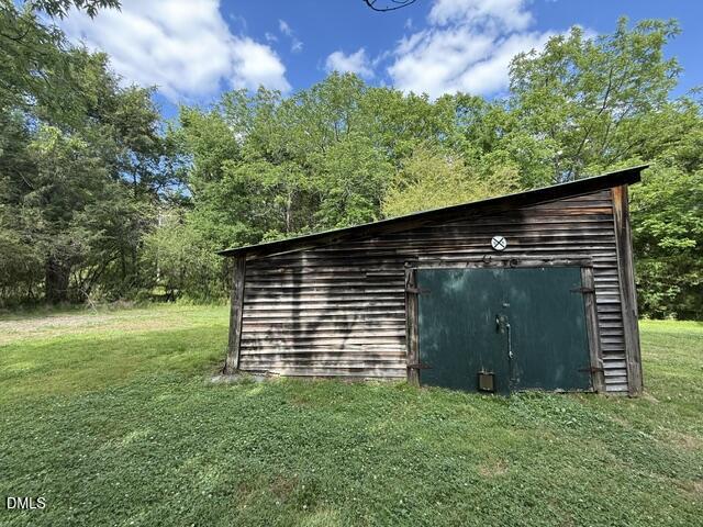 3415 Mt Willing Road Efland, NC 27243 - Photo 28 of 36 a backyard of a house with lots of green space