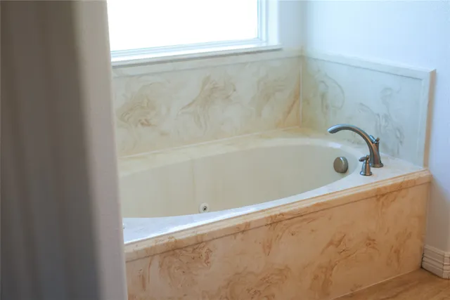 a room with a sink and cabinets