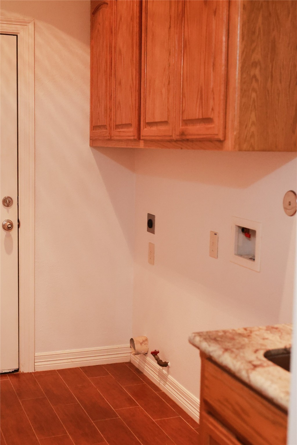 5468 Hogaboom Road Groves, TX 77619 - Photo 13 of 18 a room with a sink and cabinets