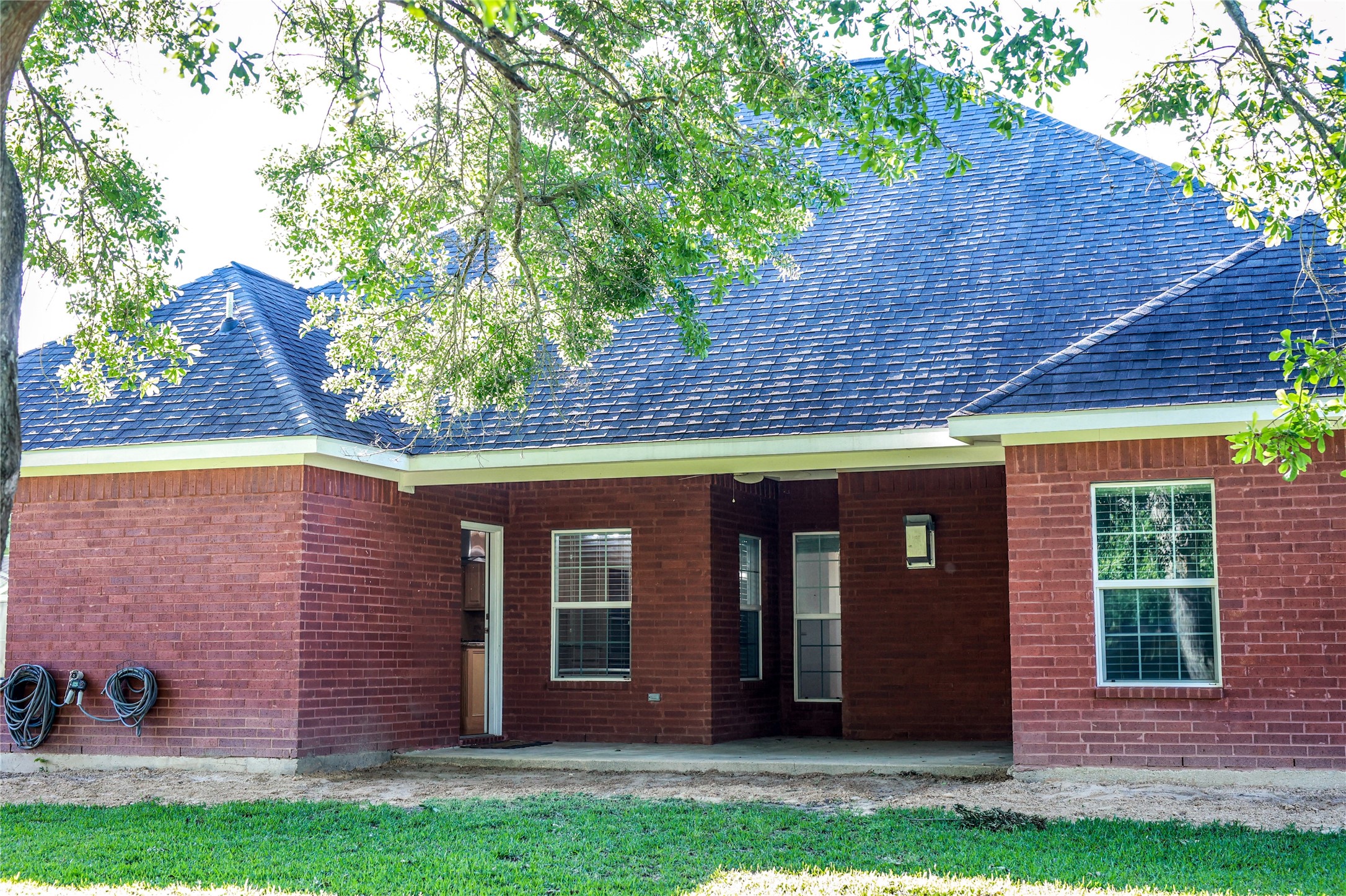 5468 Hogaboom Road Groves, TX 77619 - Photo 14 of 18 front view of a house with a yard