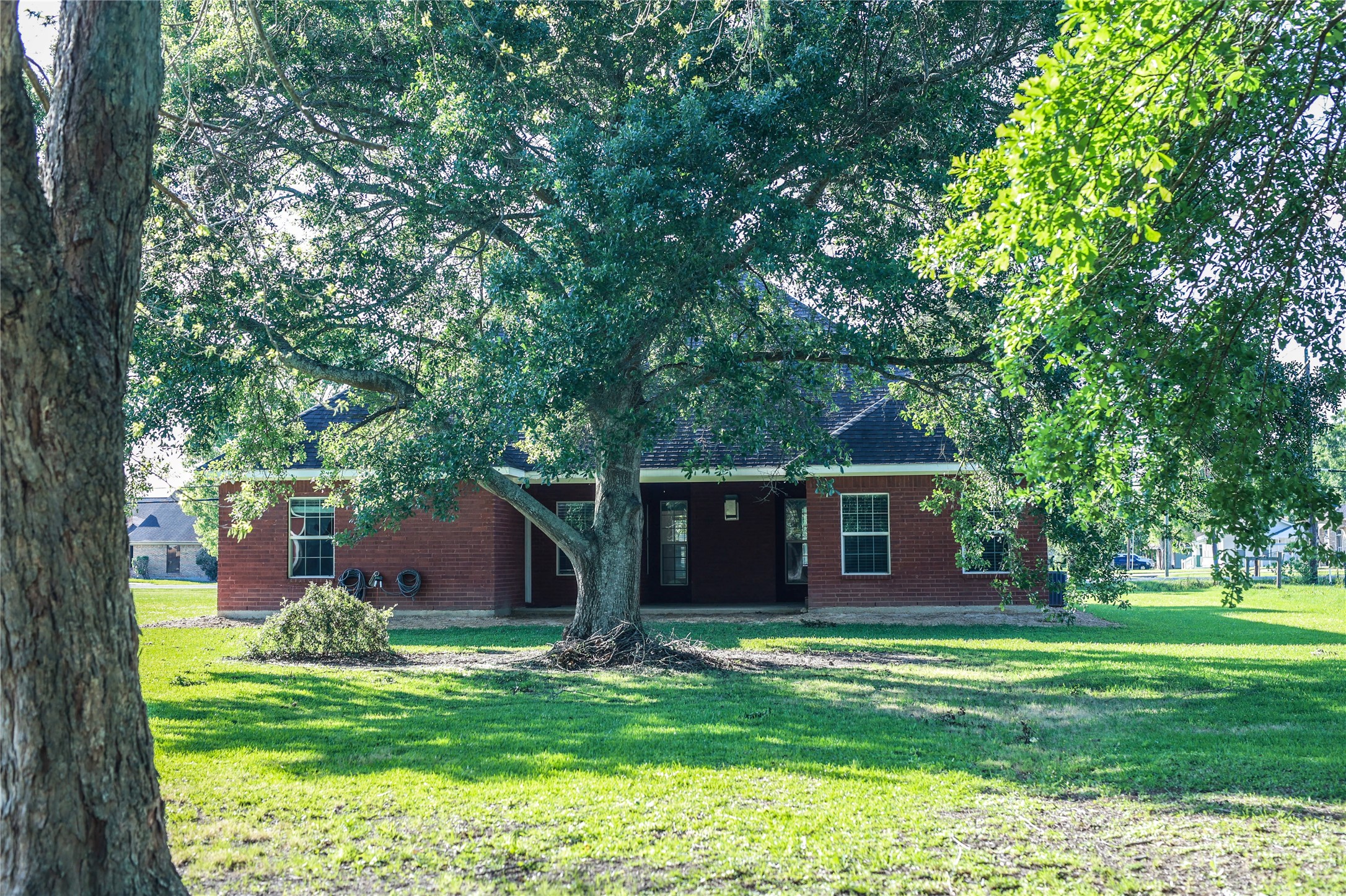 5468 Hogaboom Road Groves, TX 77619 - Photo 15 of 18 a front view of a house with a garden