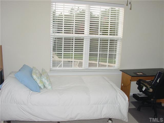 7672 Winners Edge Street Raleigh, NC 27617 - Photo 12 of 17 A wonderful view of the tree tops from this bedroom.