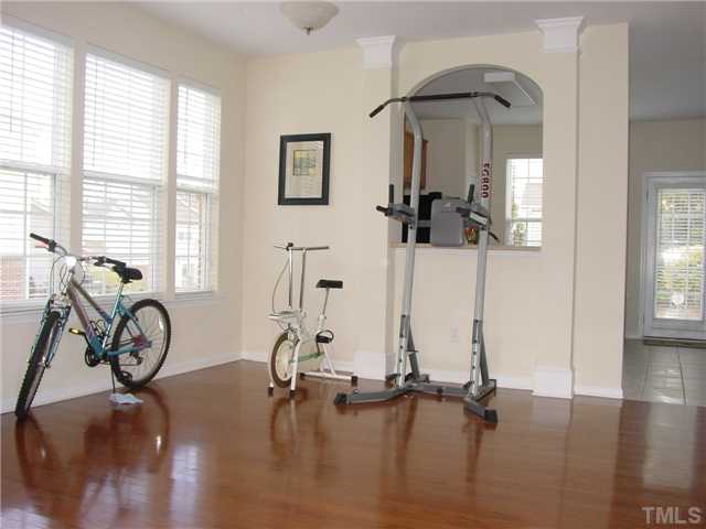 7672 Winners Edge Street Raleigh, NC 27617 - Photo 4 of 17 Dinning room curretnly being used as a work out area. All gym equipment stays with the home!