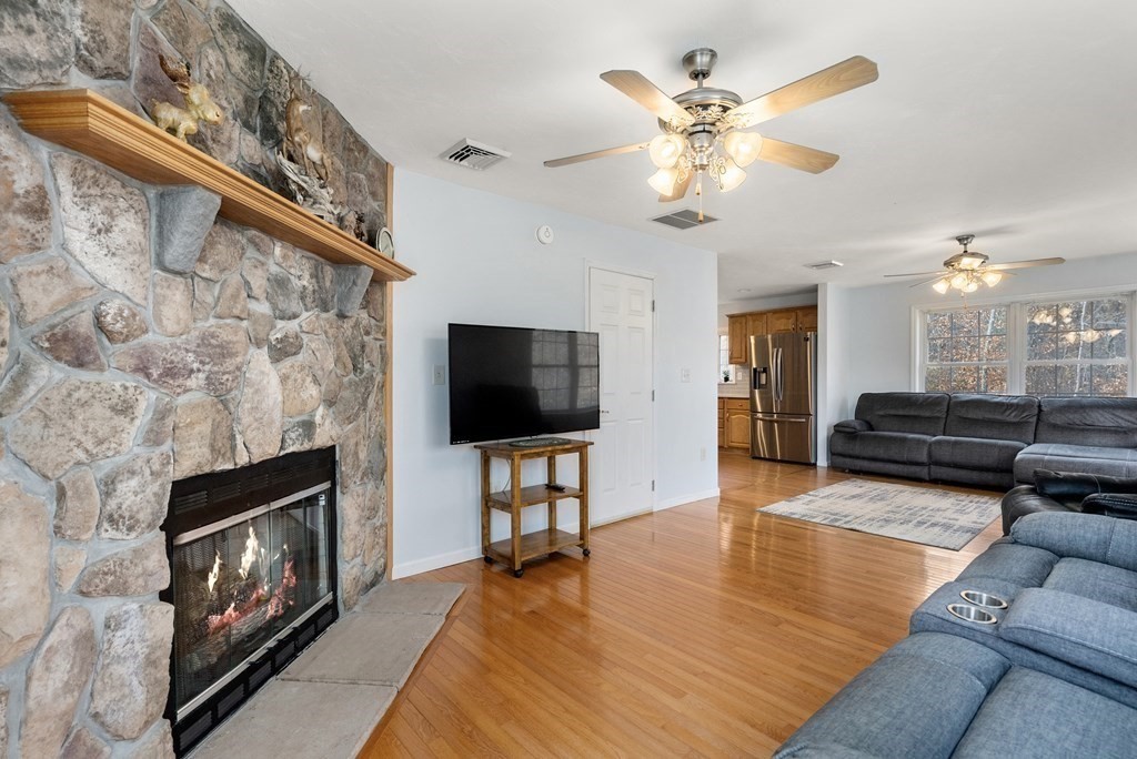 597 Old Warren Road Palmer, MA 01069 - Photo 14 of 37 a living room with furniture and a flat screen tv
