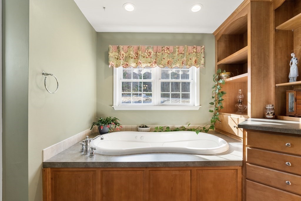 597 Old Warren Road Palmer, MA 01069 - Photo 19 of 37 a bathroom with a granite countertop sink and a window