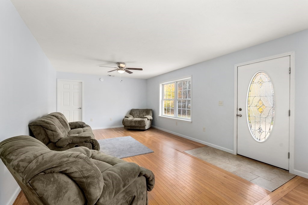 597 Old Warren Road Palmer, MA 01069 - Photo 2 of 37 a living room with furniture and a window