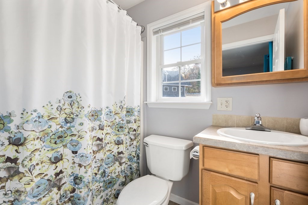 597 Old Warren Road Palmer, MA 01069 - Photo 23 of 37 a bathroom with a sink toilet and window