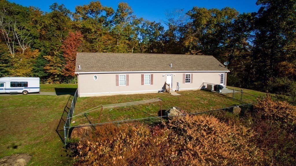 597 Old Warren Road Palmer, MA 01069 - Photo 32 of 37 a view of a house with a yard