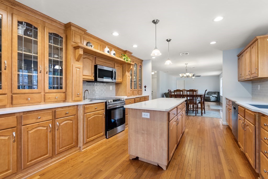 597 Old Warren Road Palmer, MA 01069 - Photo 5 of 37 a kitchen with stainless steel appliances granite countertop a stove and a sink
