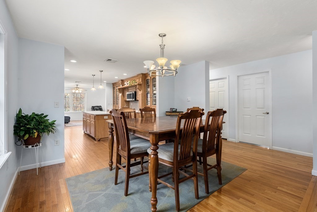 597 Old Warren Road Palmer, MA 01069 - Photo 9 of 37 a view of a dining room with furniture and wooden floor
