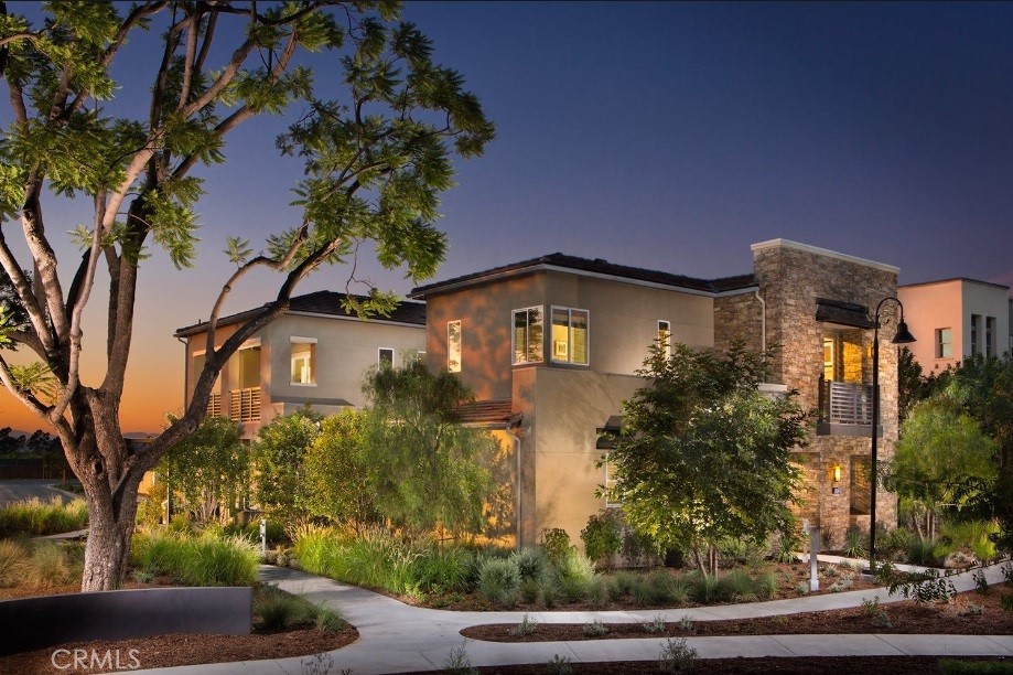 a front view of a house with trees