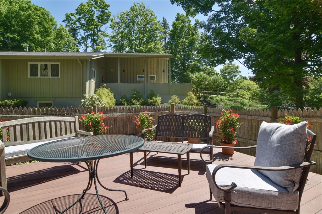 33 Grove Street Framingham, MA 01701 - Photo 25 of 33 a view of a chairs and table in the back yard