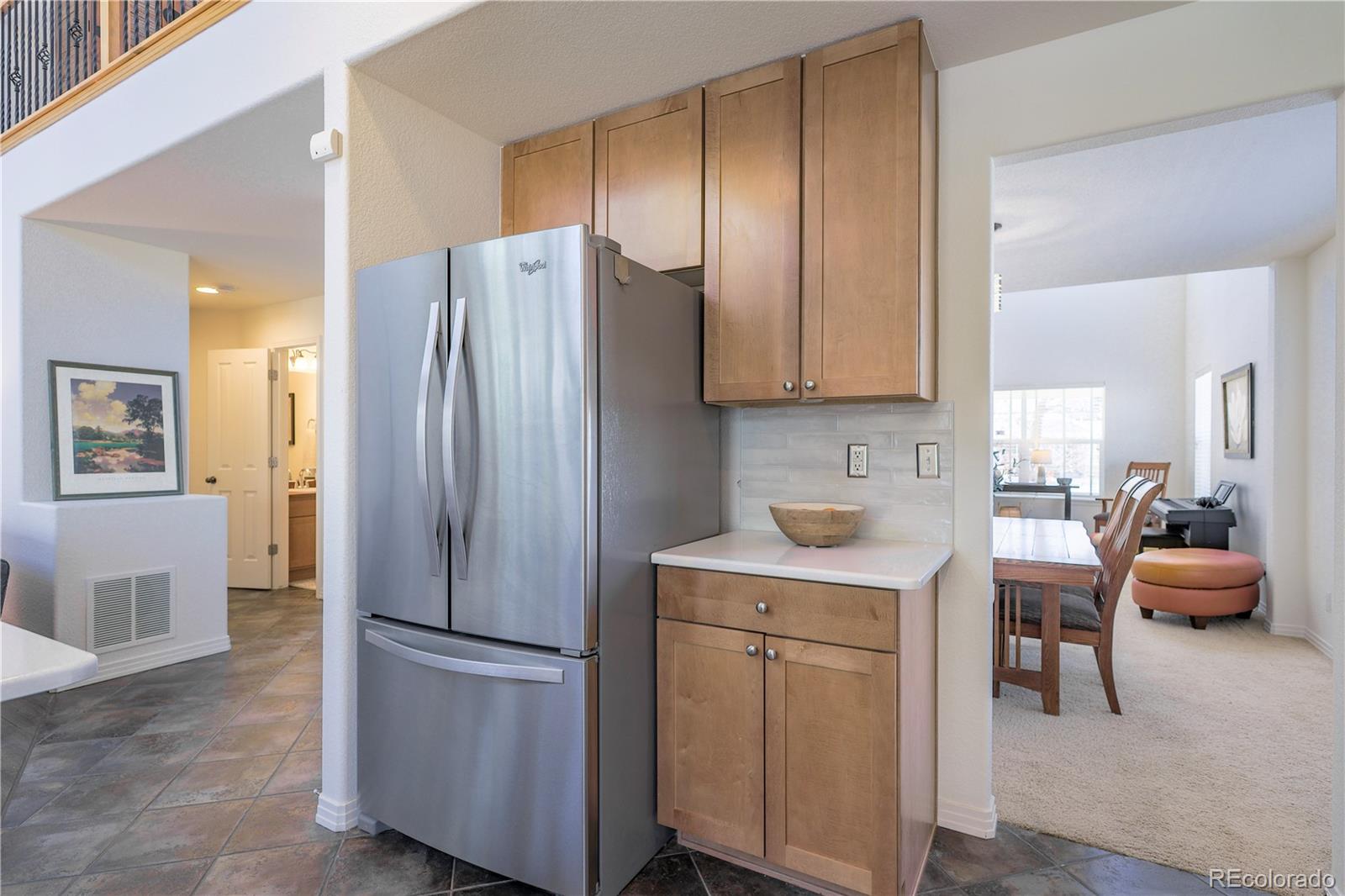 3754 Broadview Place Castle Rock, CO 80109 - Photo 11 of 43 a kitchen with stainless steel appliances a refrigerator and a stove