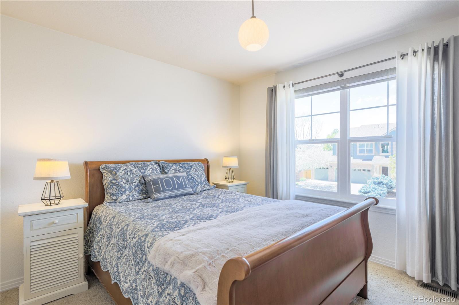 3754 Broadview Place Castle Rock, CO 80109 - Photo 30 of 43 a bedroom with a large bed and a window