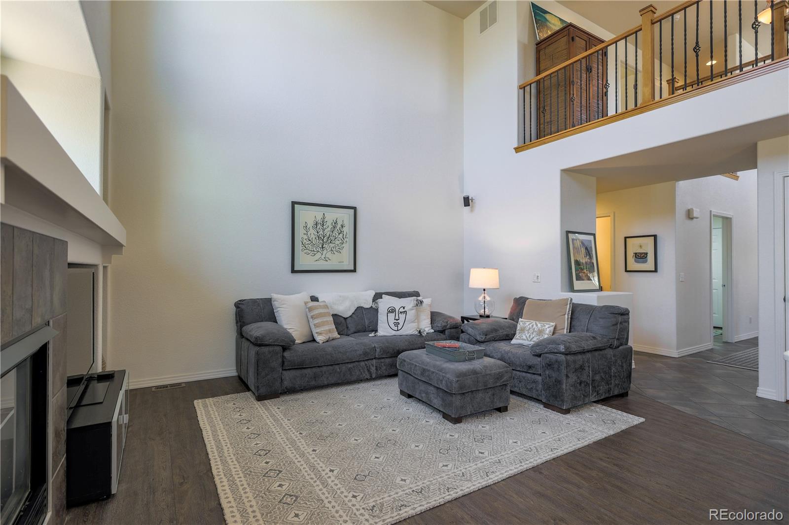 3754 Broadview Place Castle Rock, CO 80109 - Photo 7 of 43 a living room with furniture and a fireplace