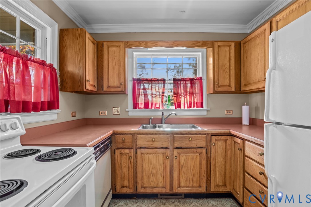 6800 Bethlehem Road Henrico, VA 23228 - Photo 3 of 25 Kitchen featuring white appliances, brown cabinets