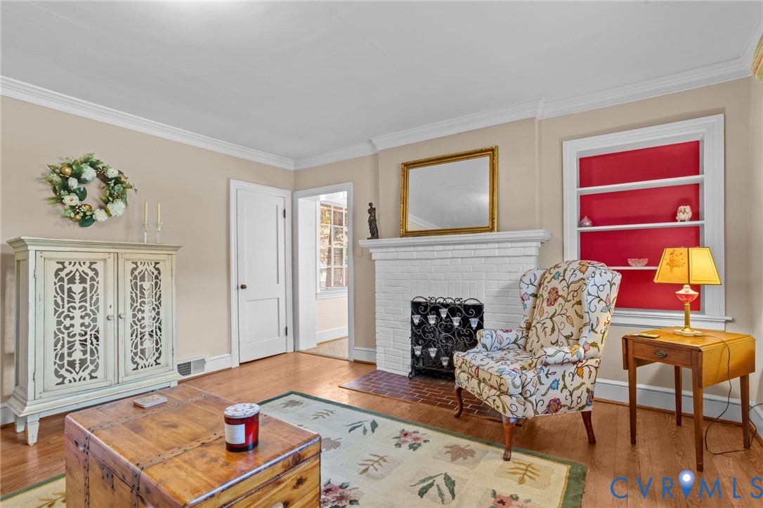 6800 Bethlehem Road Henrico, VA 23228 - Photo 7 of 25 Living area featuring a fireplace, wood finished f
