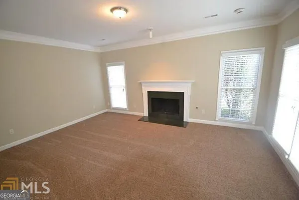 an empty room that has a window in it