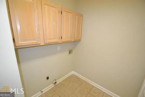 a kitchen with granite countertop a sink stove and refrigerator